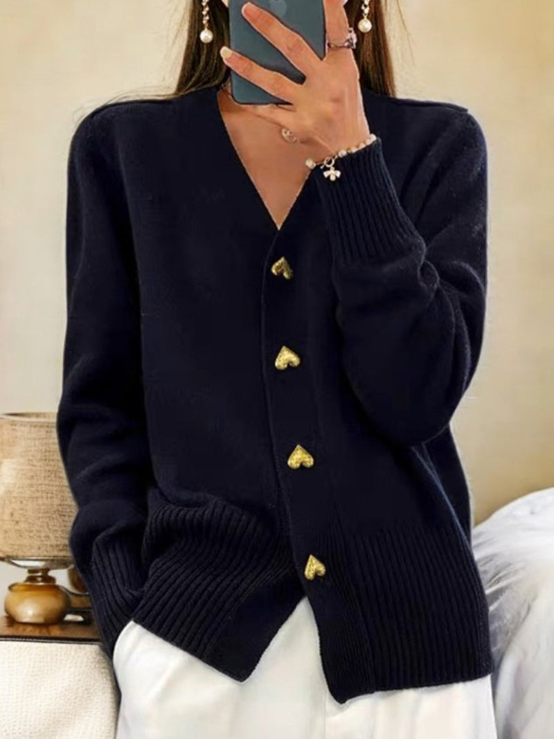 Women's cozy button-up cardigan in a warm knit, perfect for elegant winter layering and casual comfort.
