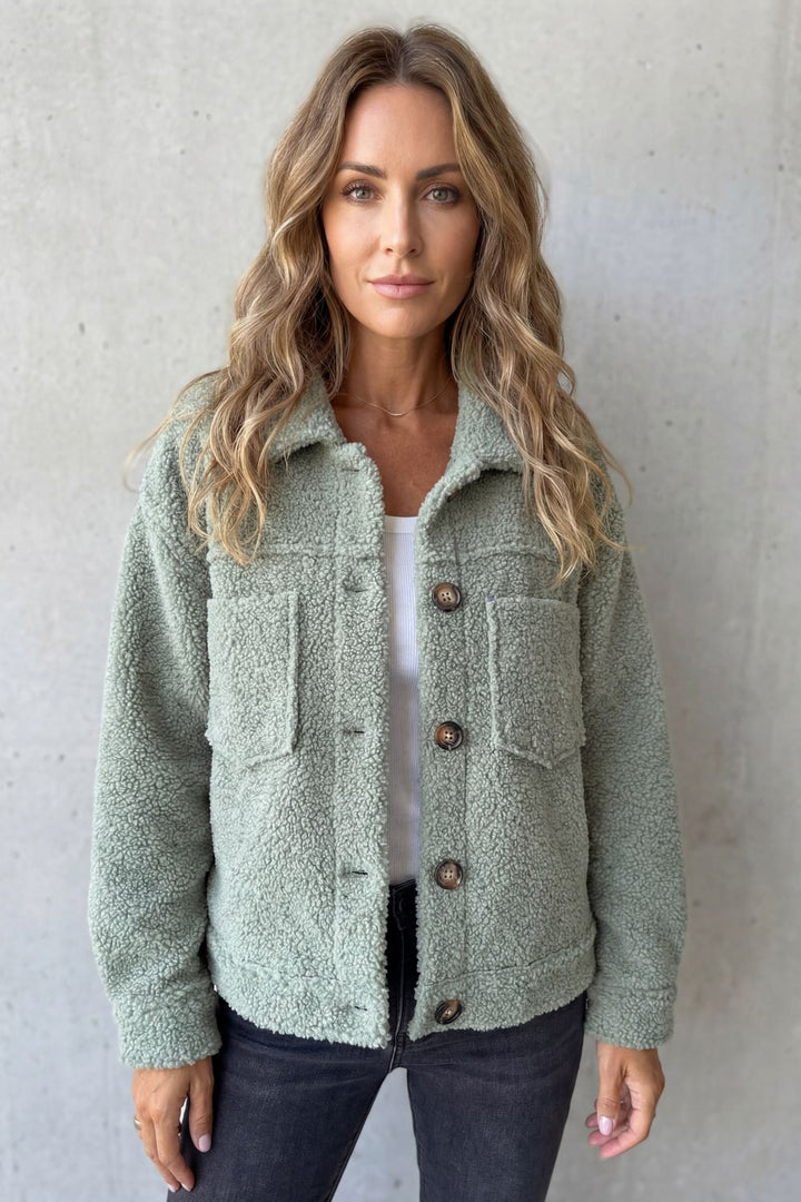 Pink cozy button-up jacket for women, a versatile layering piece for spring & fall outfits.