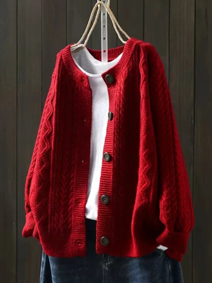 Chic oversized cable-knit cardigan for women. Cozy button-down style, a versatile autumn & winter fashion piece.