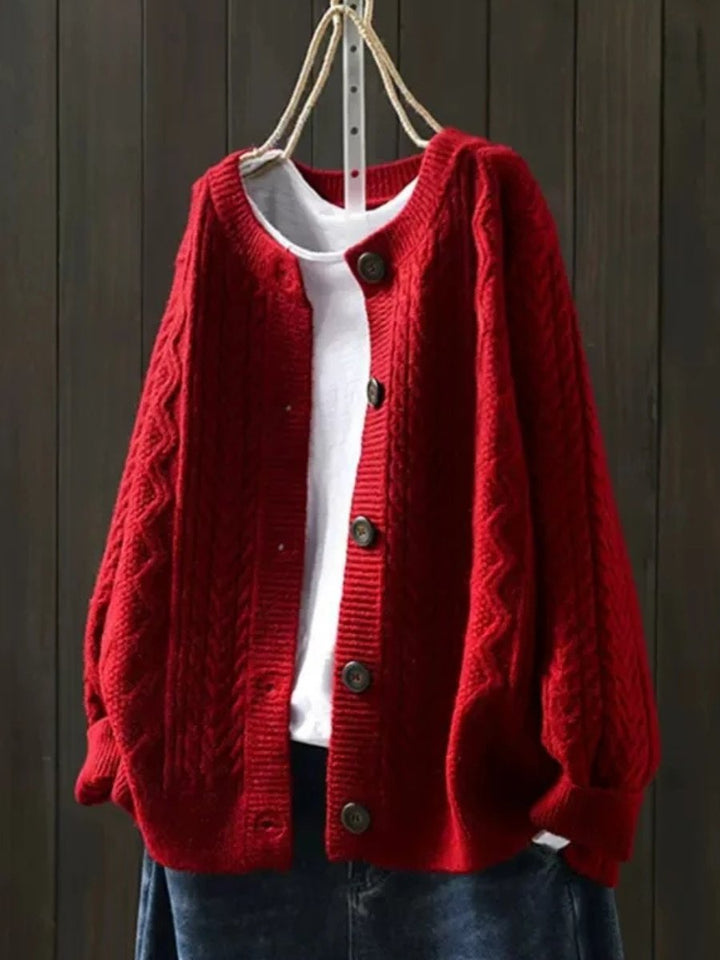 Chic oversized cable-knit cardigan for women. Cozy button-down style, a versatile autumn & winter fashion piece.