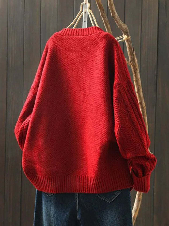 Soft women's cable-knit cardigan. Button-down, relaxed fit. Timeless and warm for cooler seasons.