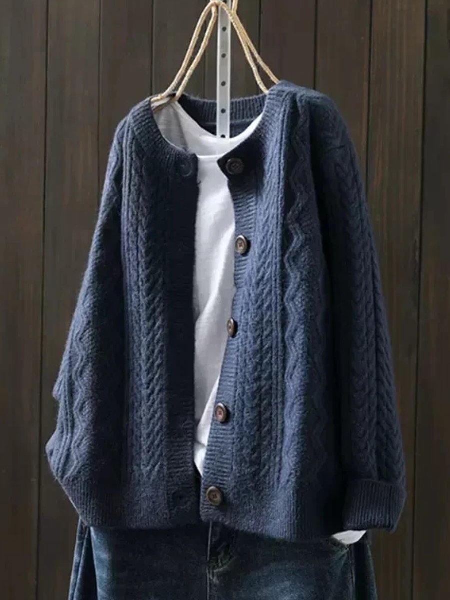 Women's comfy button-down cable-knit cardigan, a cozy and stylish layering piece for relaxed elegance.