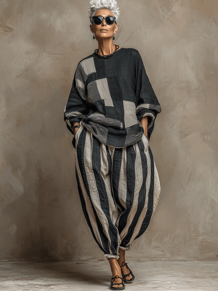 Woman in a comfy colour-block long-sleeve top and striped trouser two-piece loungewear set.