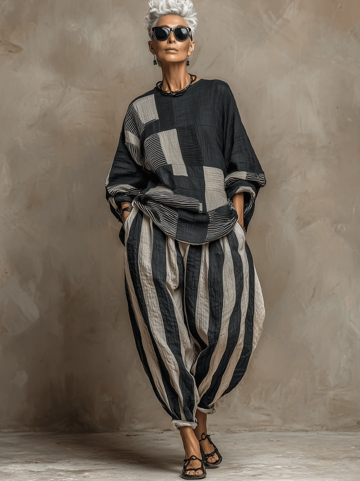 Woman in a comfy colour-block long-sleeve top and striped trouser two-piece loungewear set.