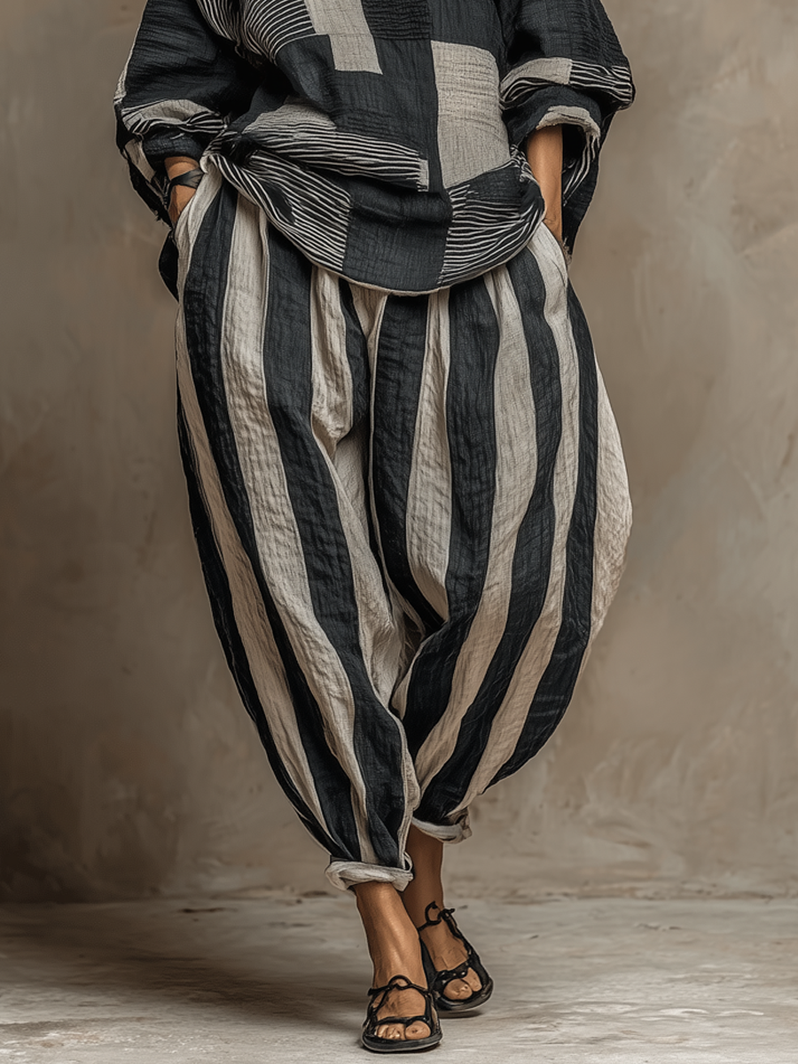 Full view of women's colour-block long-sleeve top and striped trousers two-piece loungewear set.