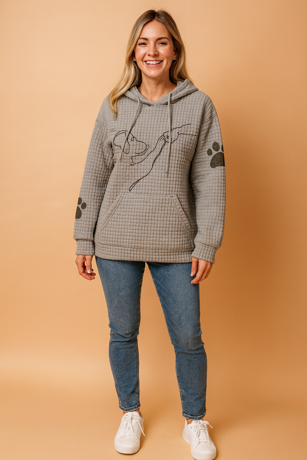 Close-up of women's dog print graphic hoodie, showing detailed animal design. Cozy long-sleeve top.