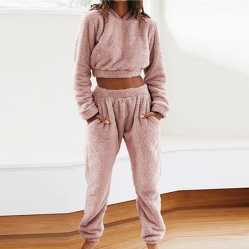 Stylish women's loungewear set featuring a soft fleece hoodie and matching pants.
