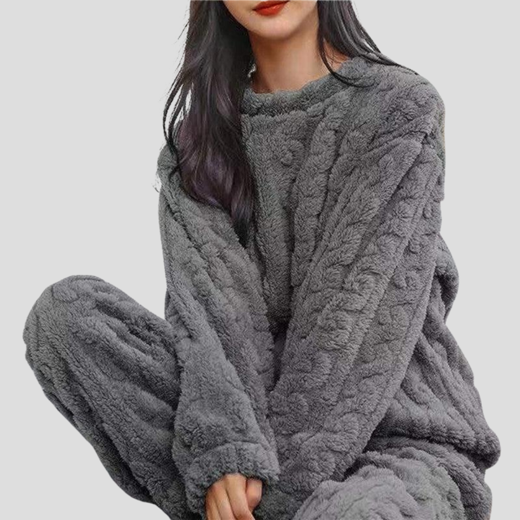 Close-up of soft fleece fabric on women's winter pajama set.