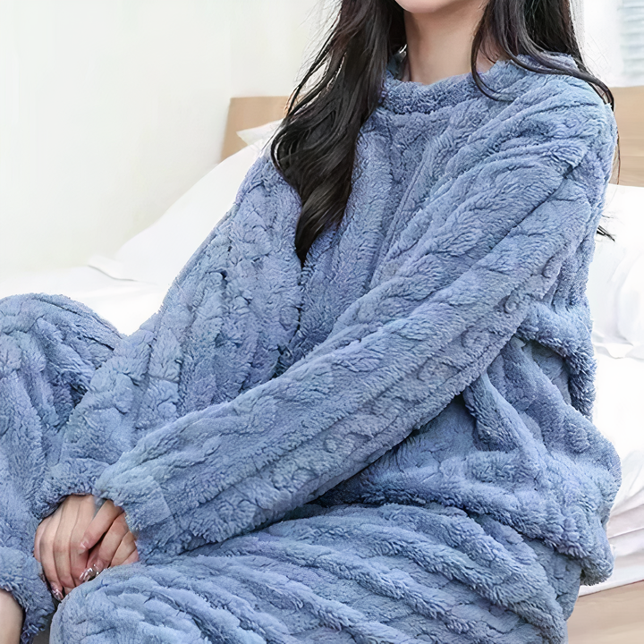 Ultra-soft women's fleece pajama set, offering warmth & comfort for winter sleep & loungewear.