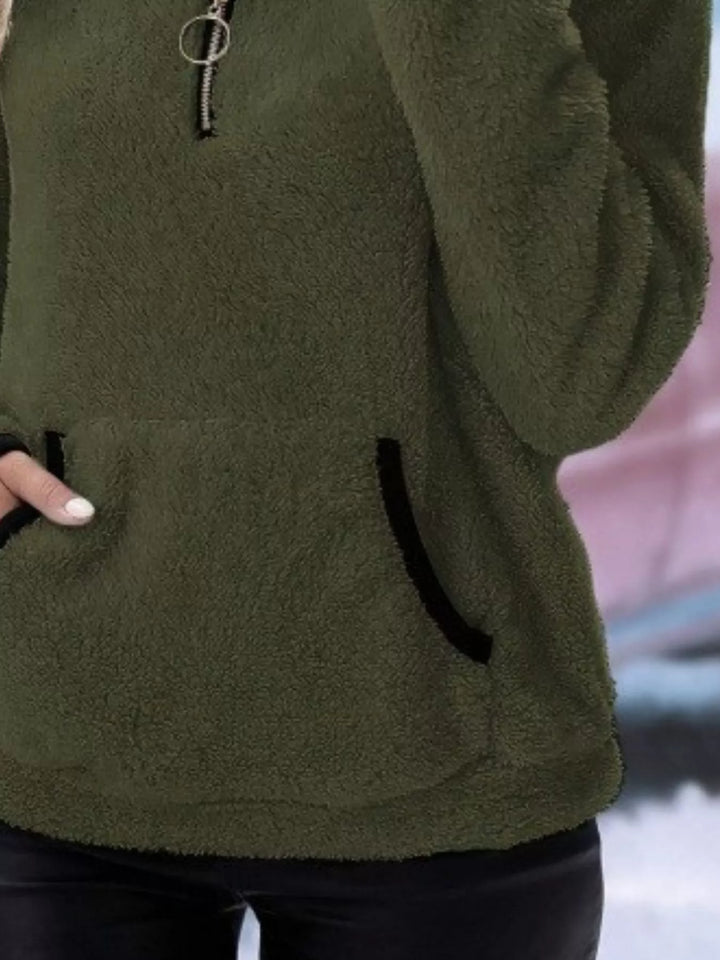 Women's half-zip pullover in a cozy, relaxed fit, great for casual winter wear.