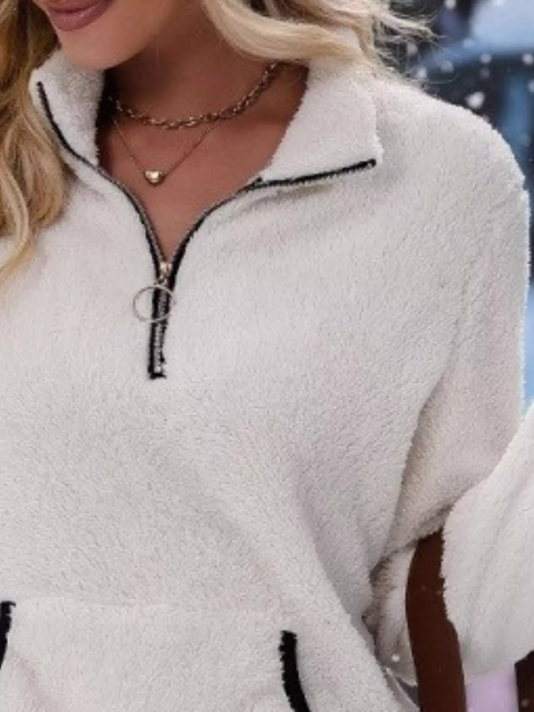 Stylish women's half-zip pullover, perfect for layering in winter fashion.