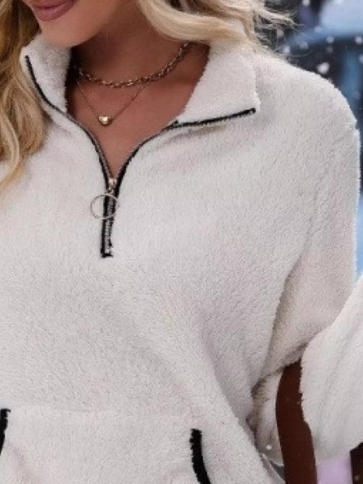 Stylish women's half-zip pullover, perfect for layering in winter fashion.
