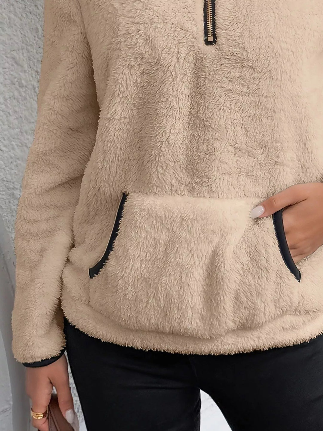 Cozy women's half-zip top, a comfortable layering piece for everyday style.