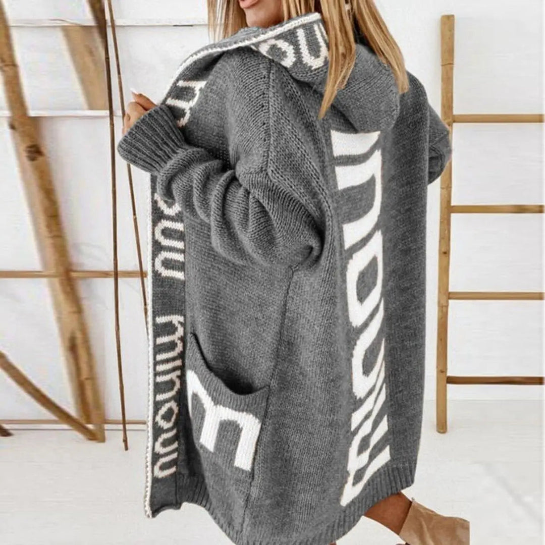 Women's hooded open-front knit cardigan jacket, longline with subtle letter print, casual winter wear.