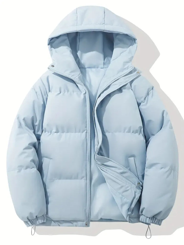 Woman modeling a warm, hooded puffer jacket, ideal for winter adventures & everyday cold weather.
