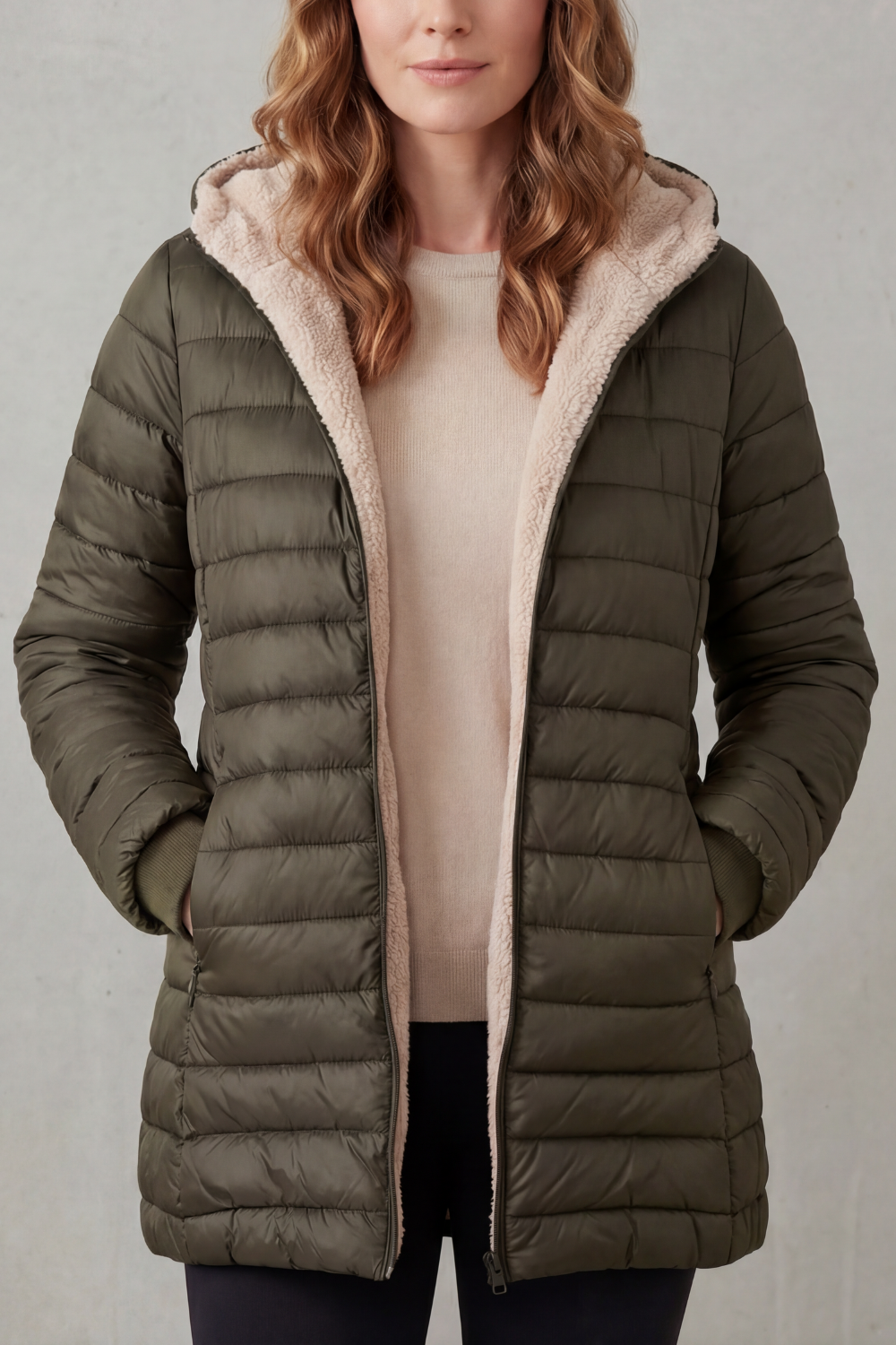 Women's hooded puffer jacket, designed as warm winter outerwear for outdoor activities & cold weather.