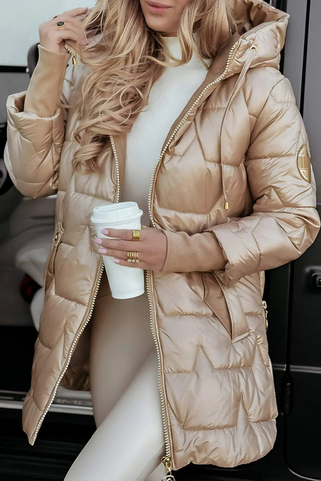 Women's cozy hooded puffer jacket in black, perfect for stylish warmth during fall and winter.