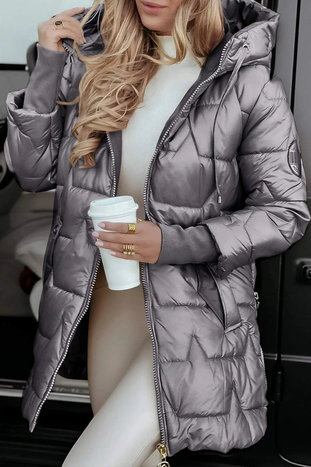 Stylish women's hooded puffer jacket, excellent for fall fashion and cozy, warm winter wear.