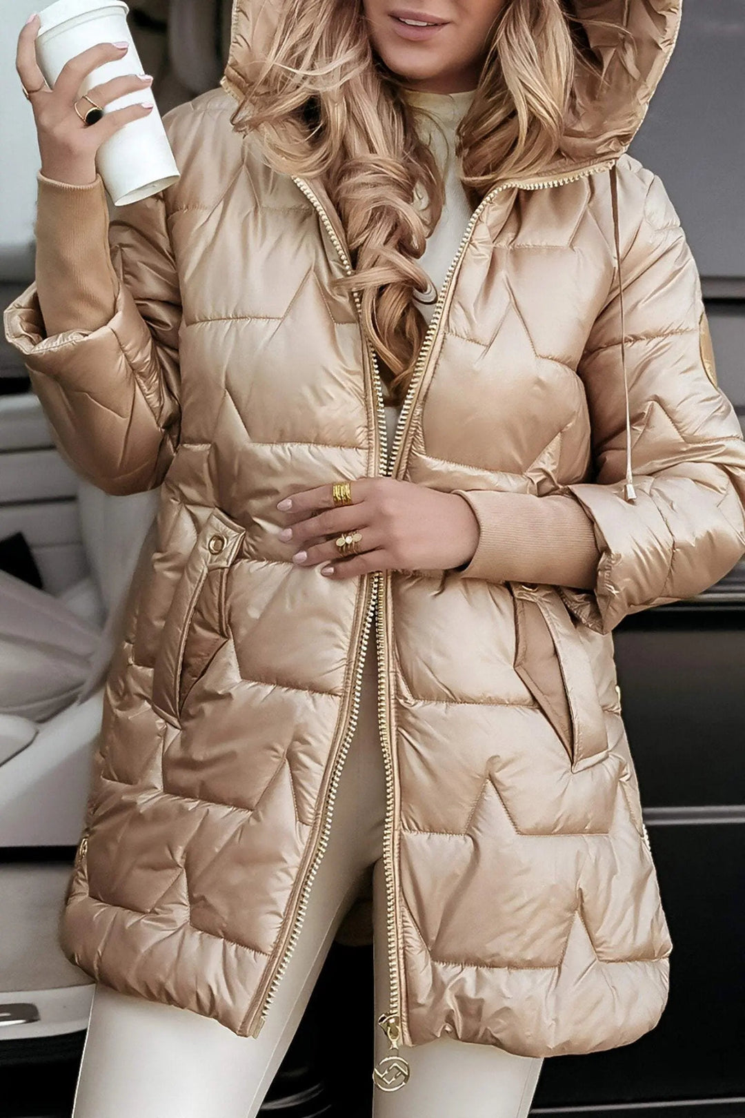 Fashionable women's hooded puffer jacket, a versatile and warm staple for fall and winter casual outfits.