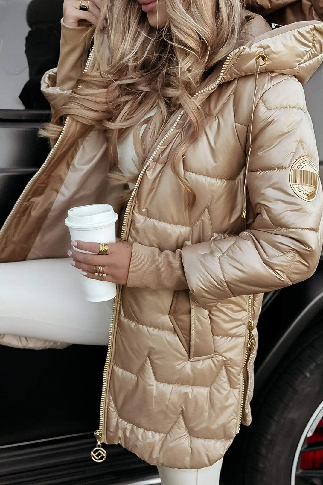 Warm & trendy women's hooded puffer jacket for outdoor adventures and stylish fall/winter casual wear.