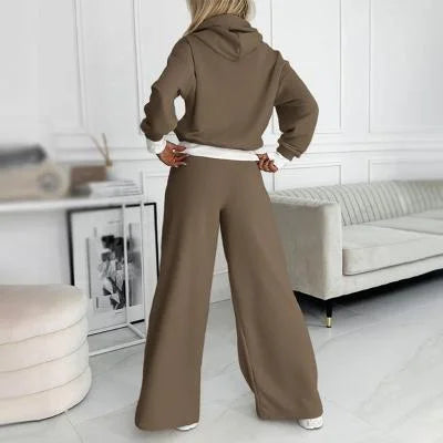 Soft women's hoodie with a relaxed fit, paired with matching wide-leg pants. Ideal for casual wear & comfort.