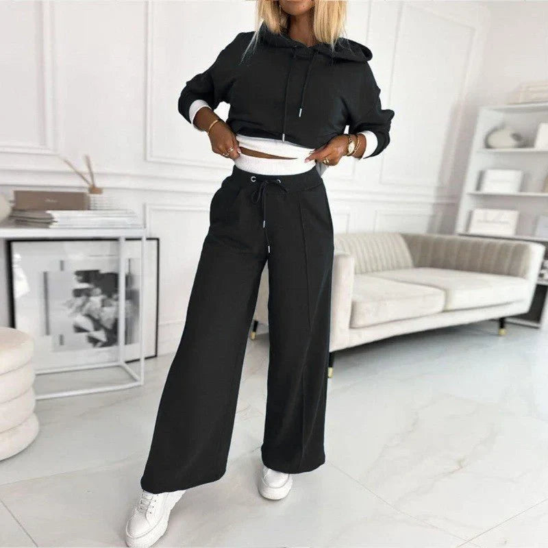 Comfortable women's two-piece set featuring a plush hoodie & wide-leg pants. Ultimate cozy loungewear for home attire.