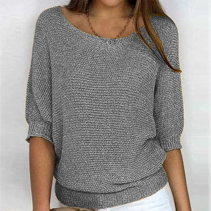 Women's cozy knit long sleeve sweater. Flattering fit, soft comfort for elegant casual wear.