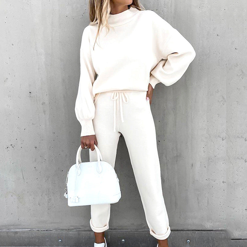 Women's cozy knit loungewear set with a relaxed fit sweater and drawstring waist pants.