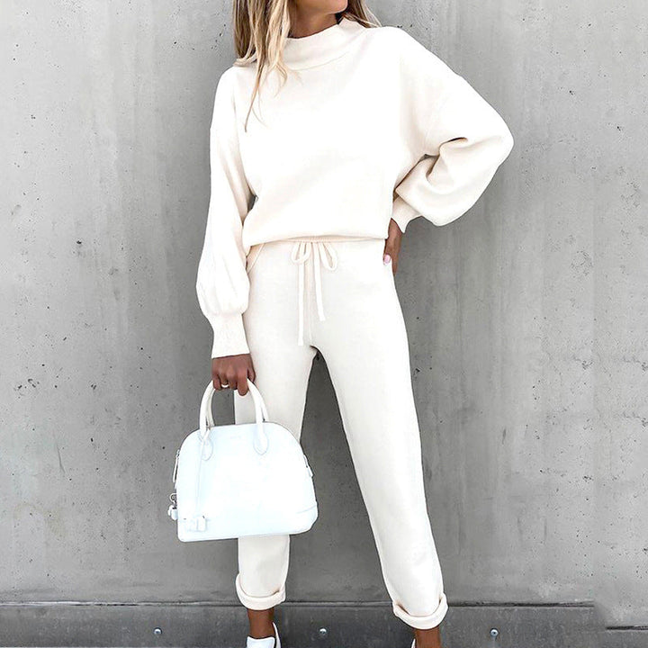 Women's cozy knit loungewear set with a relaxed fit sweater and drawstring waist pants.