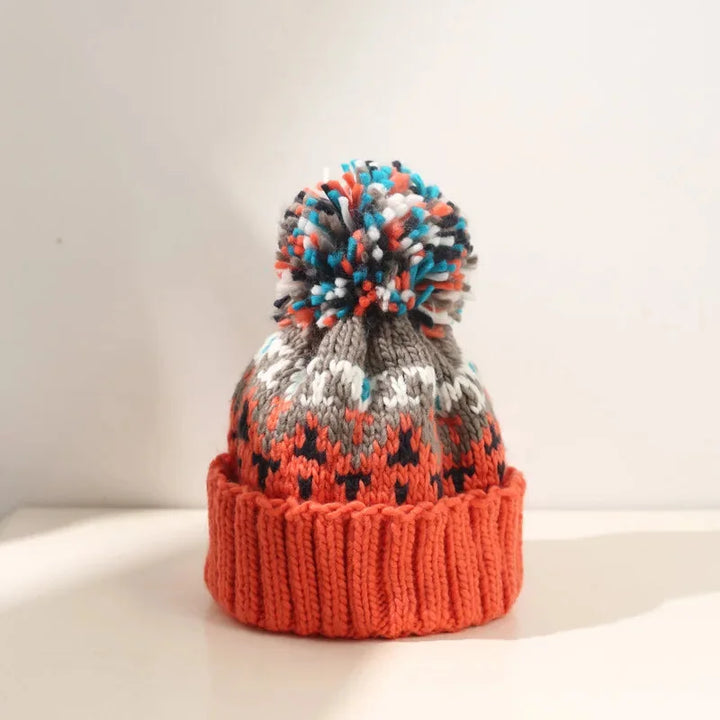 Soft women's winter beanie with a festive snowflake motif & cute pom-pom. A warm, chic cold-weather hat.