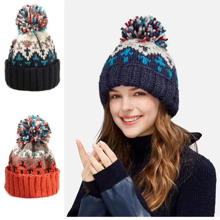 Elegant women's knit beanie with intricate snowflake design and fluffy pom-pom. Perfect for winter fashion.