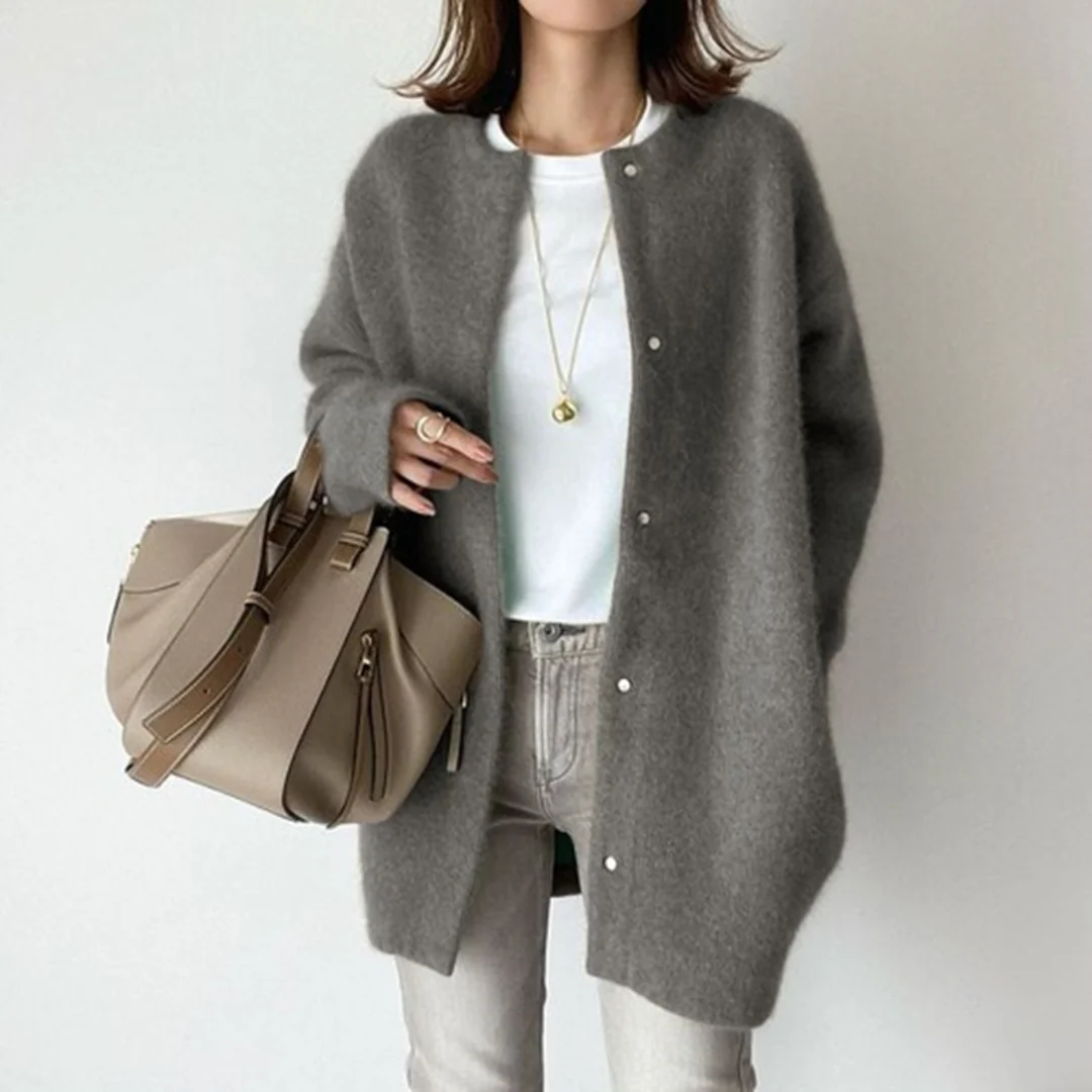 Casual chic women's long knit cardigan. Effortless button-front oversized sweater for comfortable everyday layering.