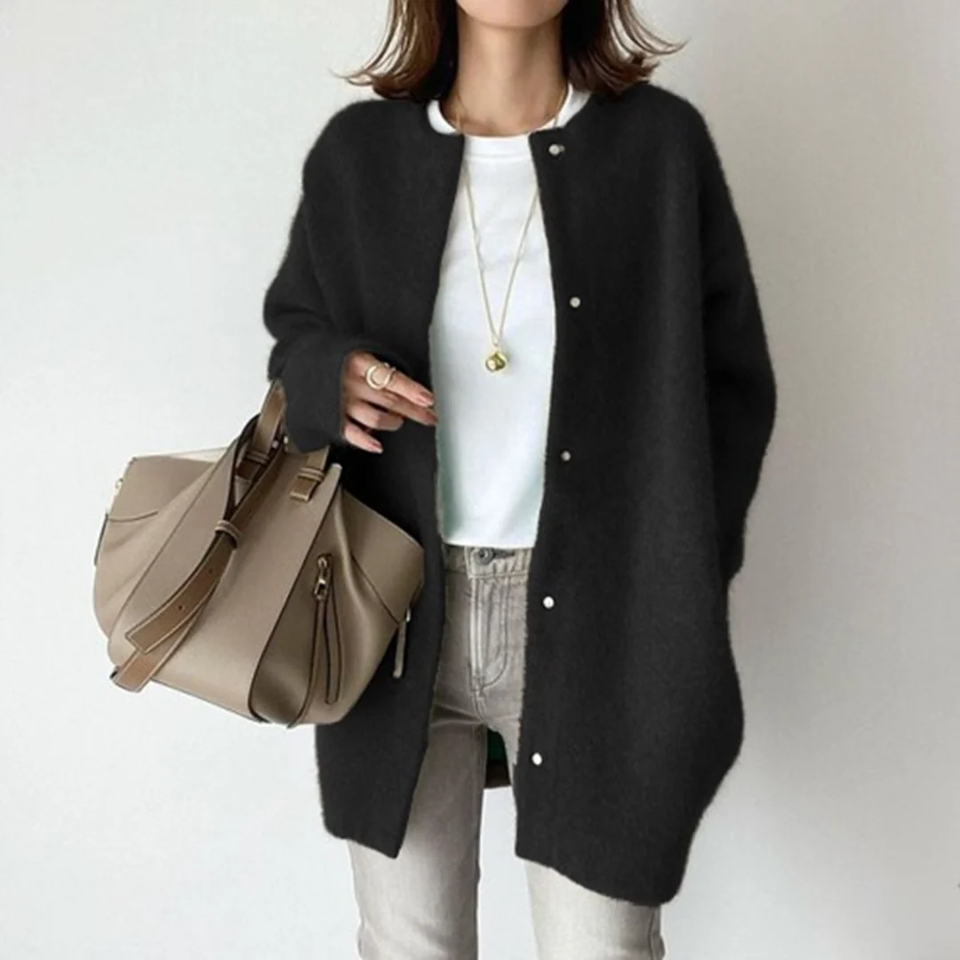 Oversized women's long cardigan sweater. Soft, cozy knit with button front, perfect as a fall or winter layering piece.