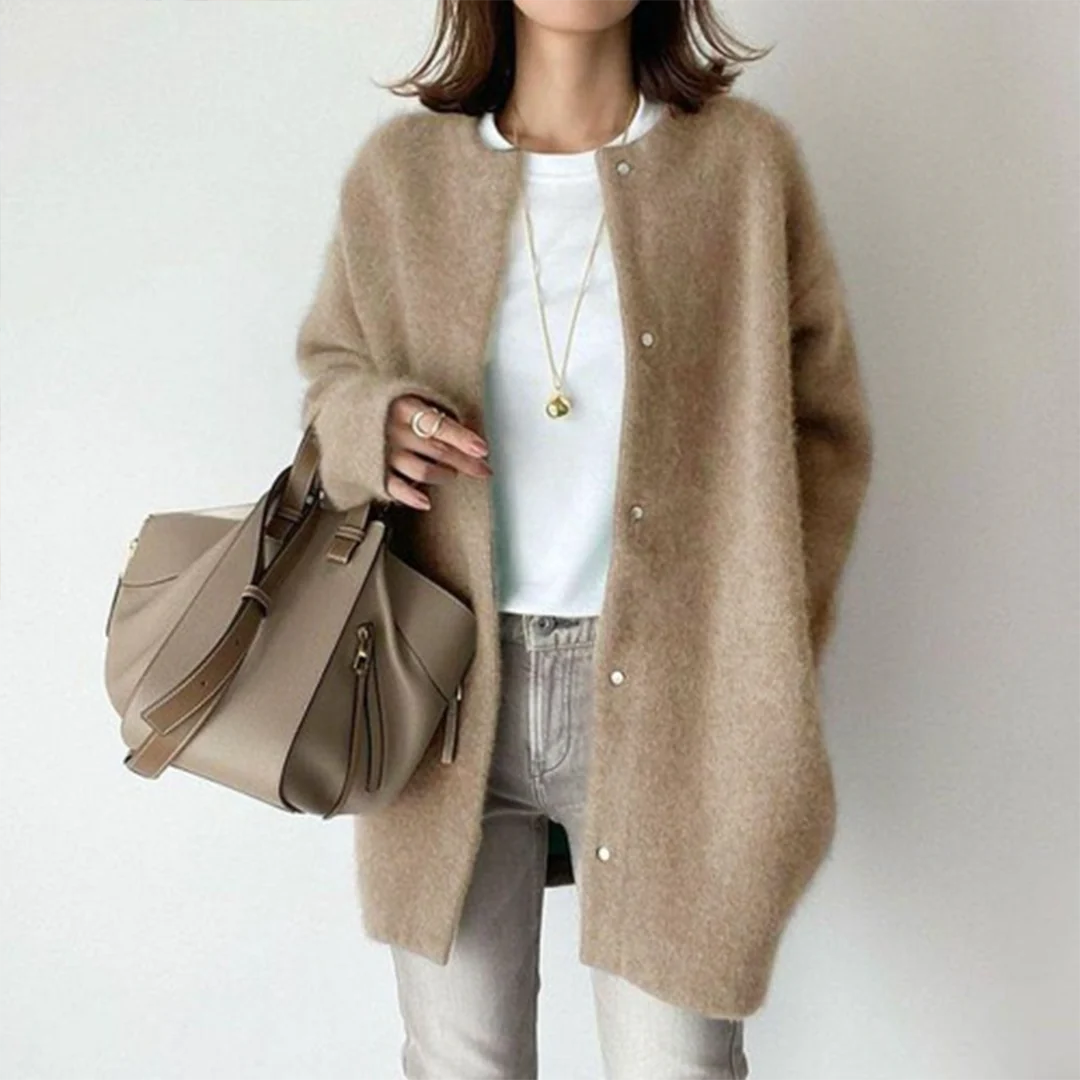 Transitional women's long cardigan for effortless layering. Cozy, oversized, button-front sweater for casual fall outfits.