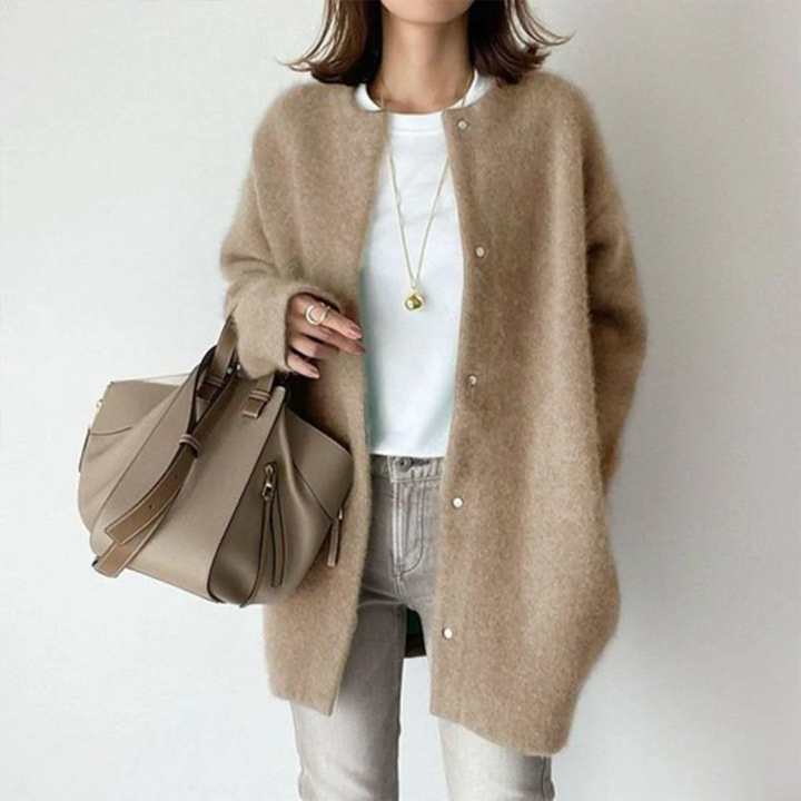Transitional women's long cardigan for effortless layering. Cozy, oversized, button-front sweater for casual fall outfits.