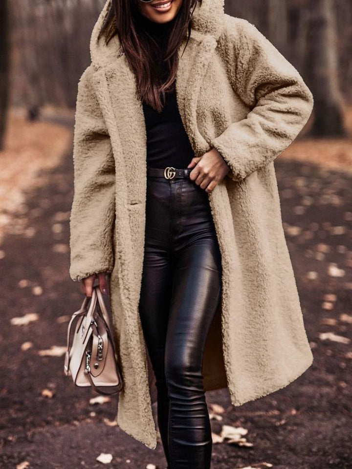 Women's cozy long hooded coat in warm teddy fabric. Perfect for winter fashion & fall outerwear.
