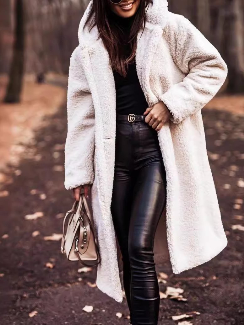 Stylish women's warm long hooded coat for winter. Cozy essential outerwear with a relaxed fit.