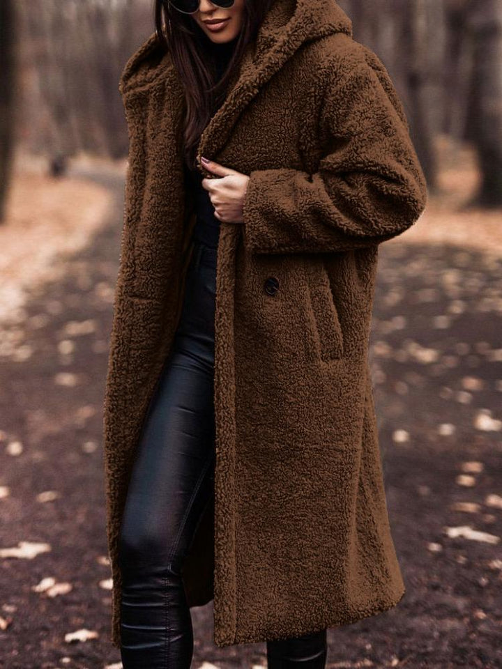Relaxed fit women's long hooded coat, ideal fall outerwear. Cozy, warm & stylish for casual days.