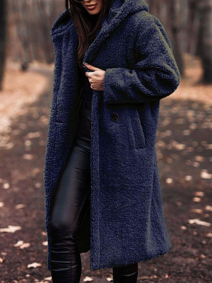 Cozy long coat for women, a stylish hooded jacket. Warm outerwear for casual fall and winter looks.