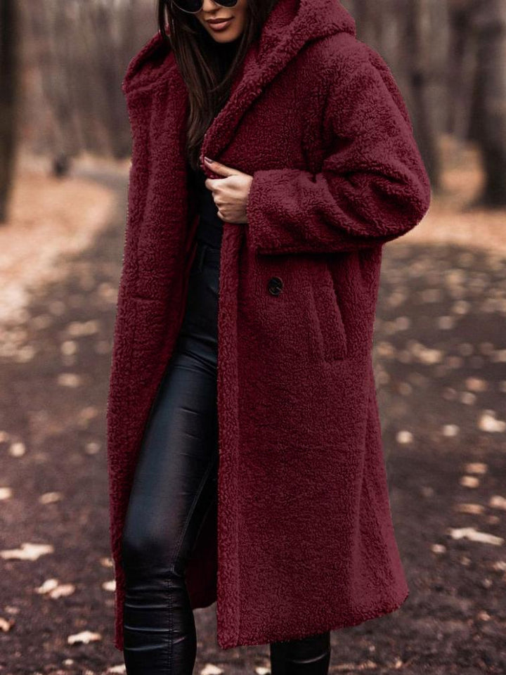 Women's hooded long coat, a cozy and warm essential. Perfect for stylish fall & winter fashion outerwear.