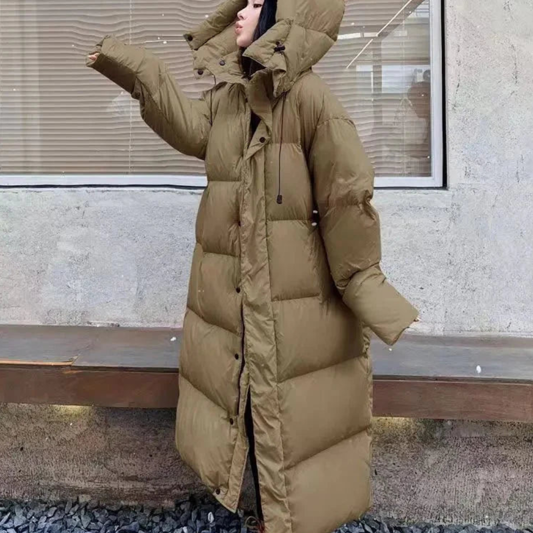 Women's cozy long puffer jacket with hood for ultimate winter warmth. Stylish and practical cold weather outerwear.