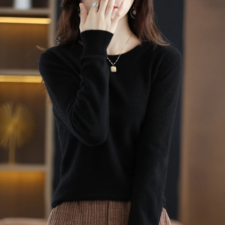 Women's soft & warm round neck sweater, luxury long sleeve for winter comfort.