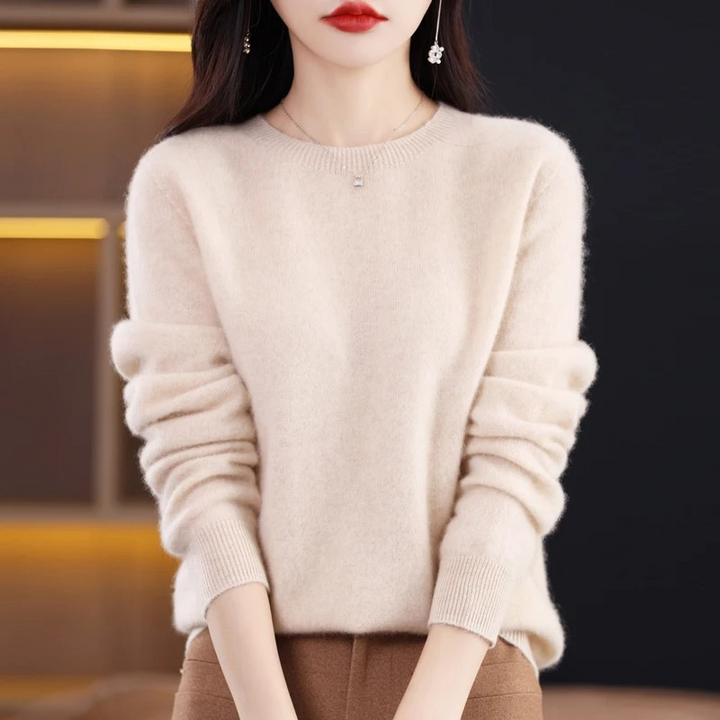 Luxury women's warm long sleeve sweater, soft round neck for winter fashion.