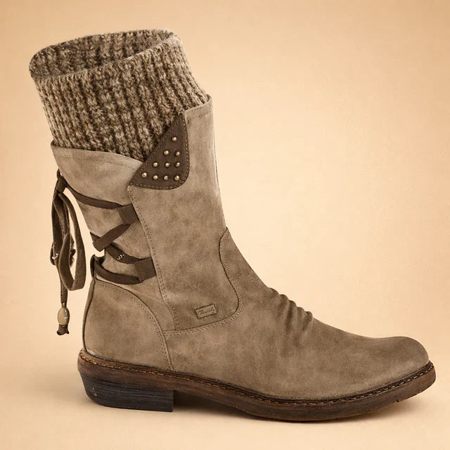 Women's lace-up mid-calf boots featuring warm knitted cuffs & slip-resistant sole. Perfect for winter.