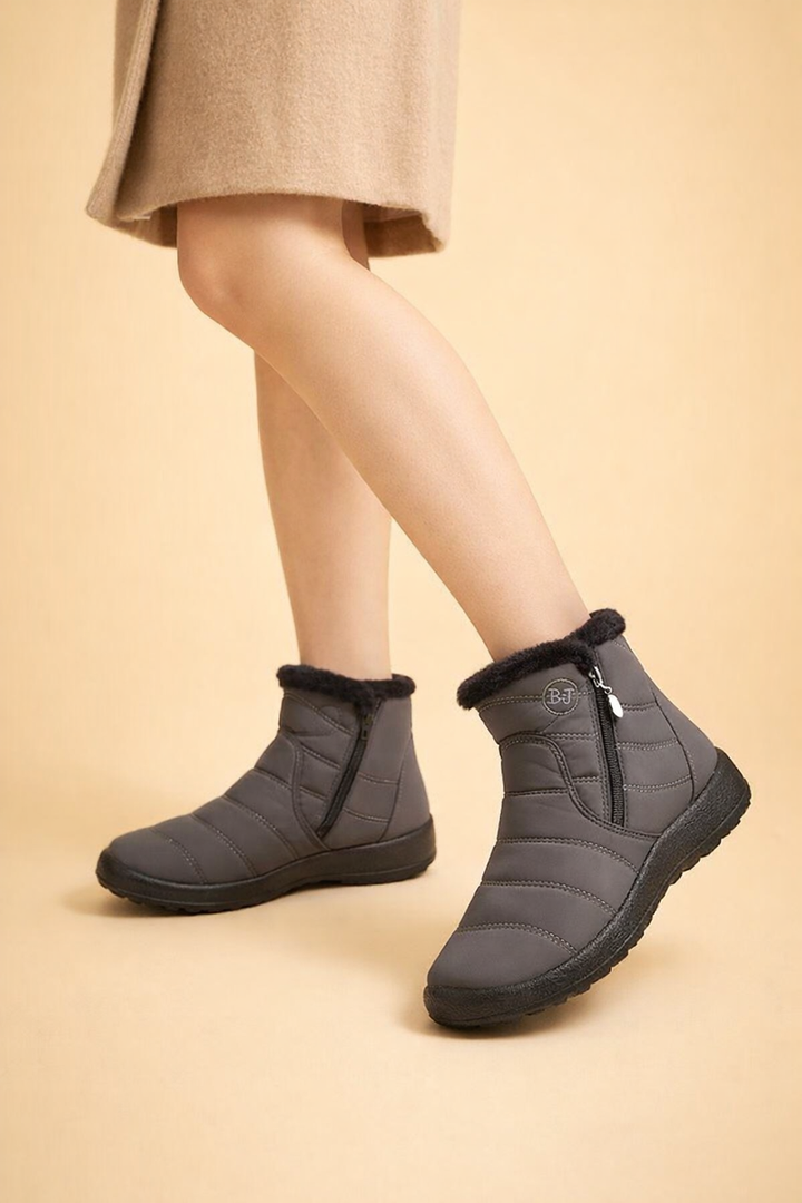Cozy women's winter boots with non-slip sole and side zip. Warm, waterproof snow footwear.