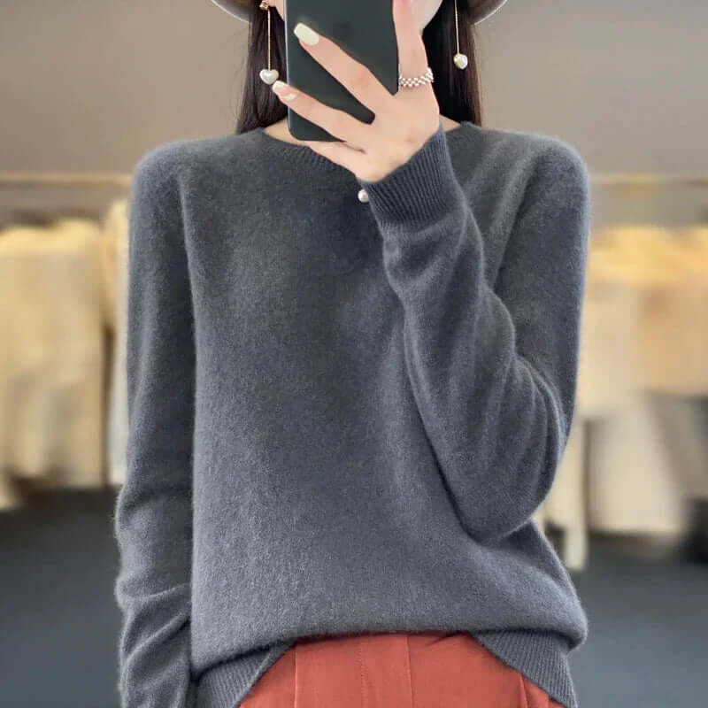 Stylish women's O-neck long sleeve sweater, a must-have cozy top for cold weather.