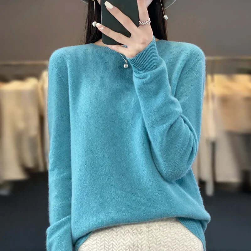 Warm women's O-neck jumper, soft knit texture, great for layering in autumn fashion.
