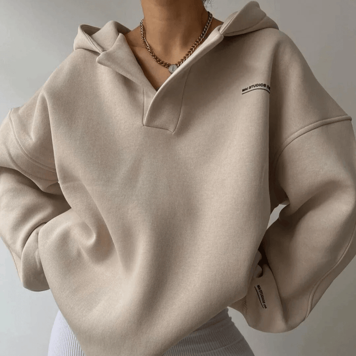 Drop-shoulder women's oversized hoodie with a chic notch neck, offering ultimate coziness and comfort.