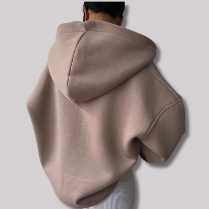 Relaxed fit women's oversized hoodie with a comfortable notch neck, ideal for cozy everyday wear.