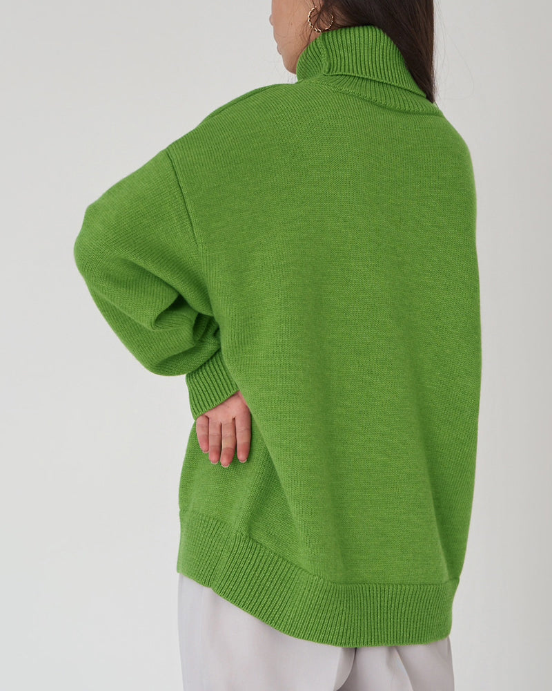 Cozy women's oversized sweater, featuring a warm turtleneck & relaxed drop shoulder for winter comfort.
